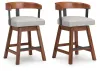 Ashley Furniture D594-224 Ralene - Upholstered Swivel Barstool (Set of 2) - Medium Brown