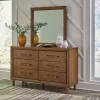 Ashley Furniture B615/31/36/46/81/97/92(2) Ashley Furniture B615/31/36/46/81/97/92(2) Lyncott - 7 Pc. - Dresser, Mirror, Chest, Queen Upholstered Bed, 2 Nightstands - Brown