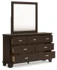 Ashley Furniture B441/31/36/46/83/87/92(2) Ashley Furniture B441/31/36/46/83/87/92(2) Covetown - 7 Pc. - Dresser, Mirror, Chest, Full Panel Bed, 2 Nightstands - Dark Brown