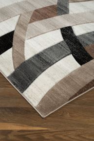 Signature Design by Ashley® R402922 Jacinth - 5' x 7' Rug - Brown