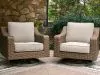 Ashley Furniture PCP790-821 Laguna Heights - Swivel Lounge With Cushion - Beige