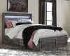 Ashley Furniture B221/31/35/57/54S/60(2)/91(2)/B100-13 Ashley Furniture B221/31/35/57/54S/60(2)/91(2)/B100-13 Baystorm - 9 Pc. - Dresser, Mirror, Queen Panel Bed with 6 Storage Drawers, 2 Nightstands - Gray