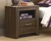 Ashley Furniture B251/31/36/46/68/66/99/92(2) Ashley Furniture B251/31/36/46/68/66/99/92(2) Juararo - 8 Pc. - Dresser, Mirror, Chest, King Poster Bed, 2 Nightstands - Dark Brown