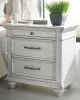 Benchcraft® B777/31/36/46/58/56S/94/93(2) Benchcraft® B777/31/36/46/58/56S/94/93(2) Kanwyn - 8 Pc. - Dresser, Mirror, Chest, California King Panel Bed with Storage Bench, 2 Nightstands - Whitewash