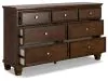Ashley Furniture B685/31/36/46/57/54/97/92(2) Ashley Furniture B685/31/36/46/57/54/97/92(2) Danabrin - 8 Pc. - Dresser, Mirror, Chest, Queen Panel Bed, 2 Nightstands - Brown