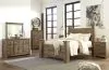 Ashley Furniture B446B40 Ashley Furniture B446B40 Trinell - Queen Poster Bed - Brown