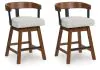 Ashley Furniture D594-224 Ralene - Upholstered Swivel Barstool (Set of 2) - Medium Brown