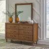 Ashley Furniture B615/31/36/81/97/92(2) Ashley Furniture B615/31/36/81/97/92(2) Lyncott - 6 Pc. - Dresser, Mirror, Queen Upholstered Bed, 2 Nightstands - Brown