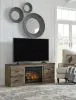 Ashley Furniture EW0446W8 Trinell - TV Stand With Electric Fireplace - Brown